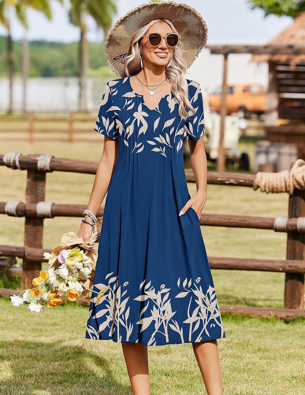 image:imageZeagoo Summer Dresses for Women 2026 Casual Short Sleeve Aline Midi Dress with Pocket Flowy Pleated Tshirt Beach SundressNavy Leaf Print